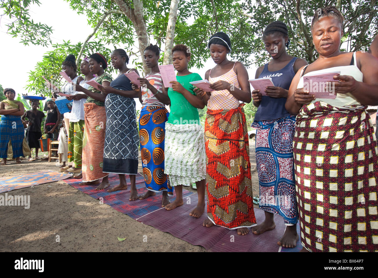 Women attend a community microfinance meeting in Kakata, Liberia, West Africa. Stock Photo