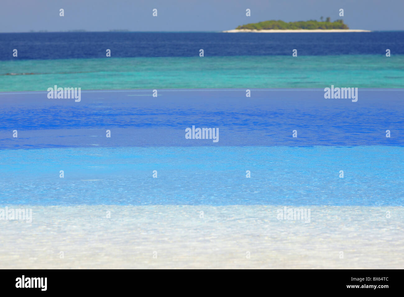 Swimming pool and tropical island, Maldives, Indian Ocean, Asia Stock Photo