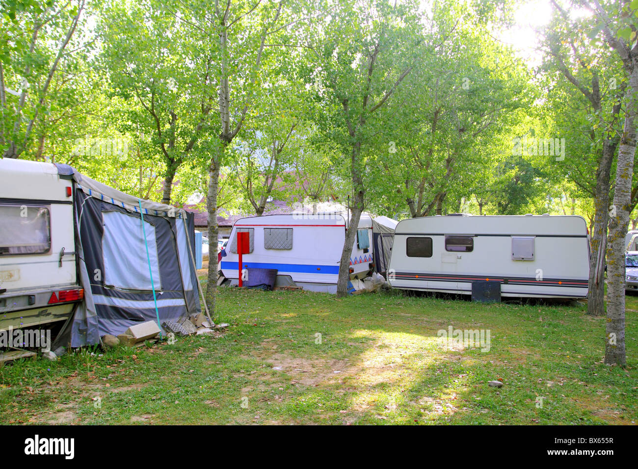 camping camper camp green outdoor trees in summer Stock Photo