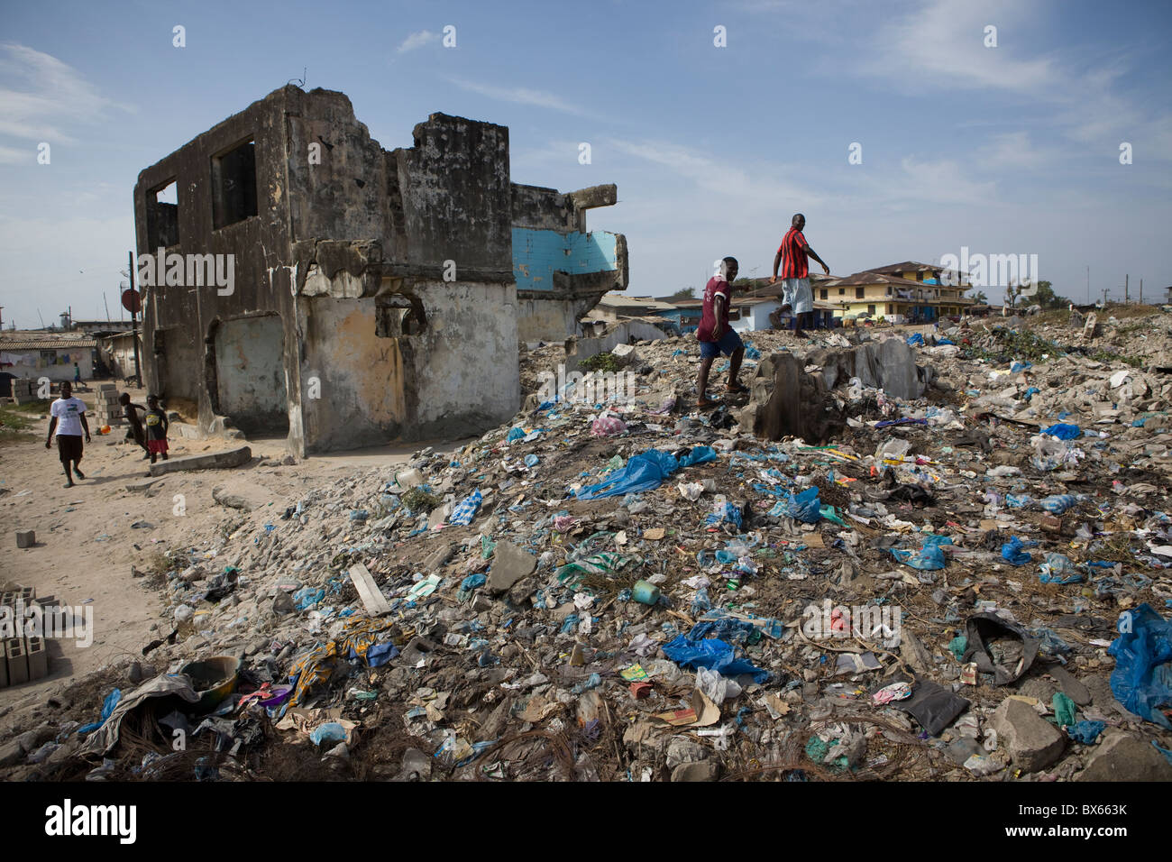 City scene along oceanfront showing war damaged buildings. | Monrovia, Liberia, West Africa. Stock Photo