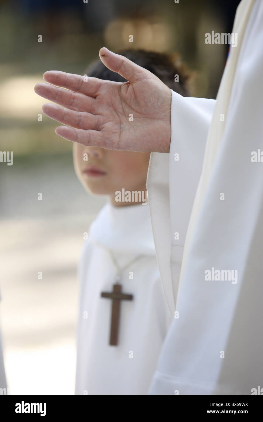 Priest and altar boy, La Roche-sur-Foron, Haute Savoie, France, Europe Stock Photo