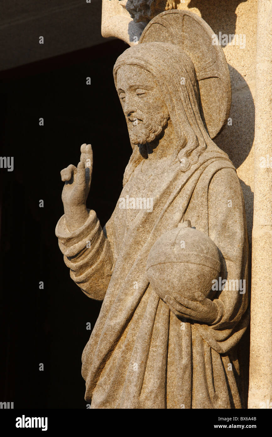 Western gate sculpture of the risen Christ holding the world, Saint-Corentin Cathedral, Quimper, Finistere, Brittany, France Stock Photo