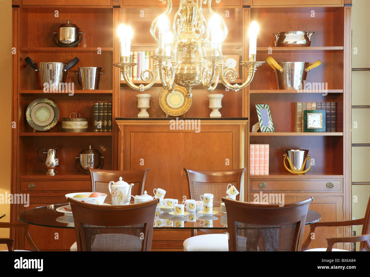 Classic living room table library furniture glowing chandelier warm ...