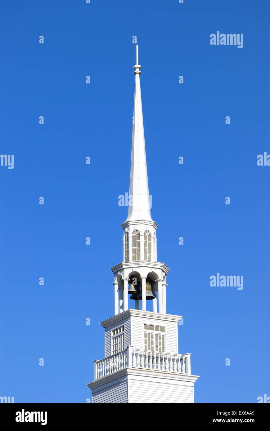 Tall white steeple to a baptist church. Stock Photo