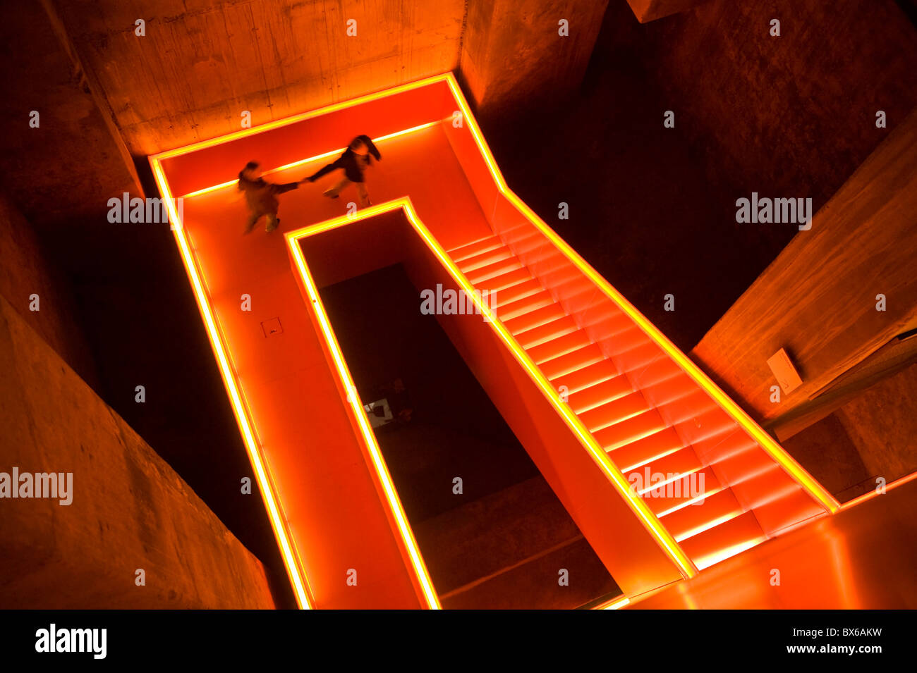 Illuminated stairwell of the former coal washery in the pit  Zollverein in Essen, Ruhr Museum today, Germany Stock Photo