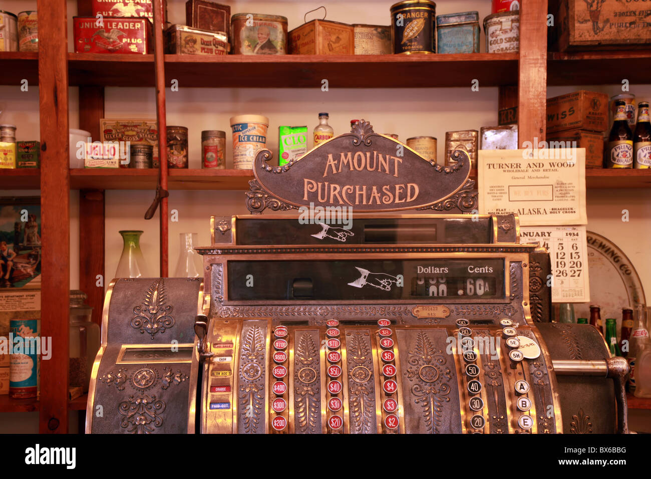 Old, antique cash register in a vintage apothecary shop in Yukon Territory, Canada. Stock Photo
