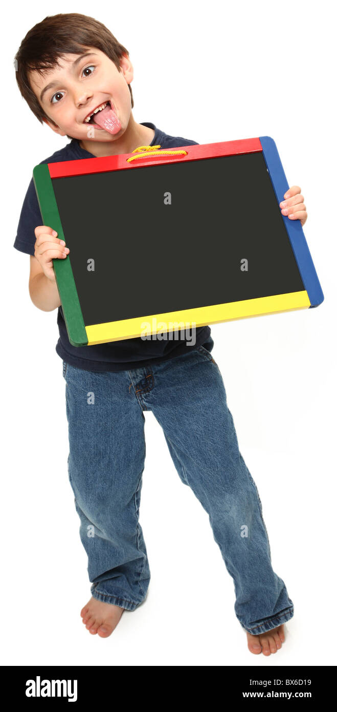 adorable seven year old boy holding blank chalk board making silly faces Stock Photo