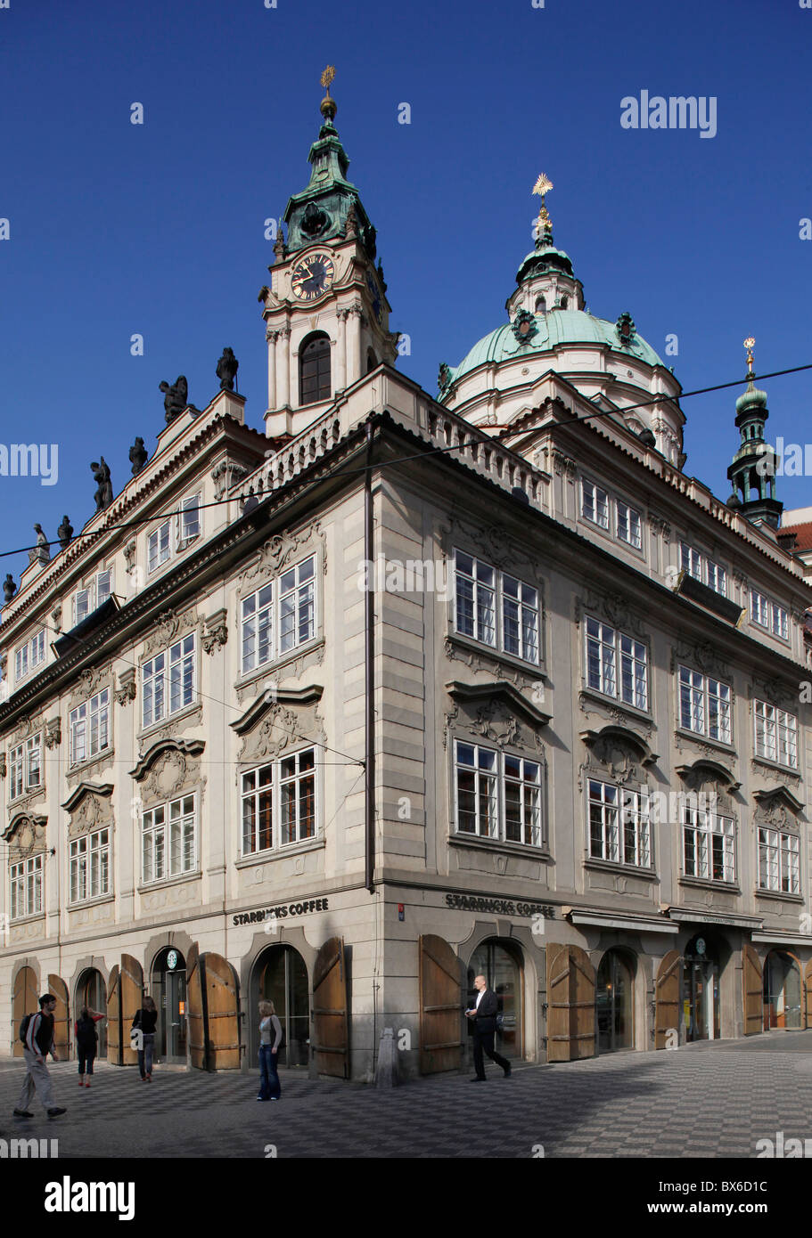 Prague, Starbucks Coffee chain with St. Nicholas cathedral behind it