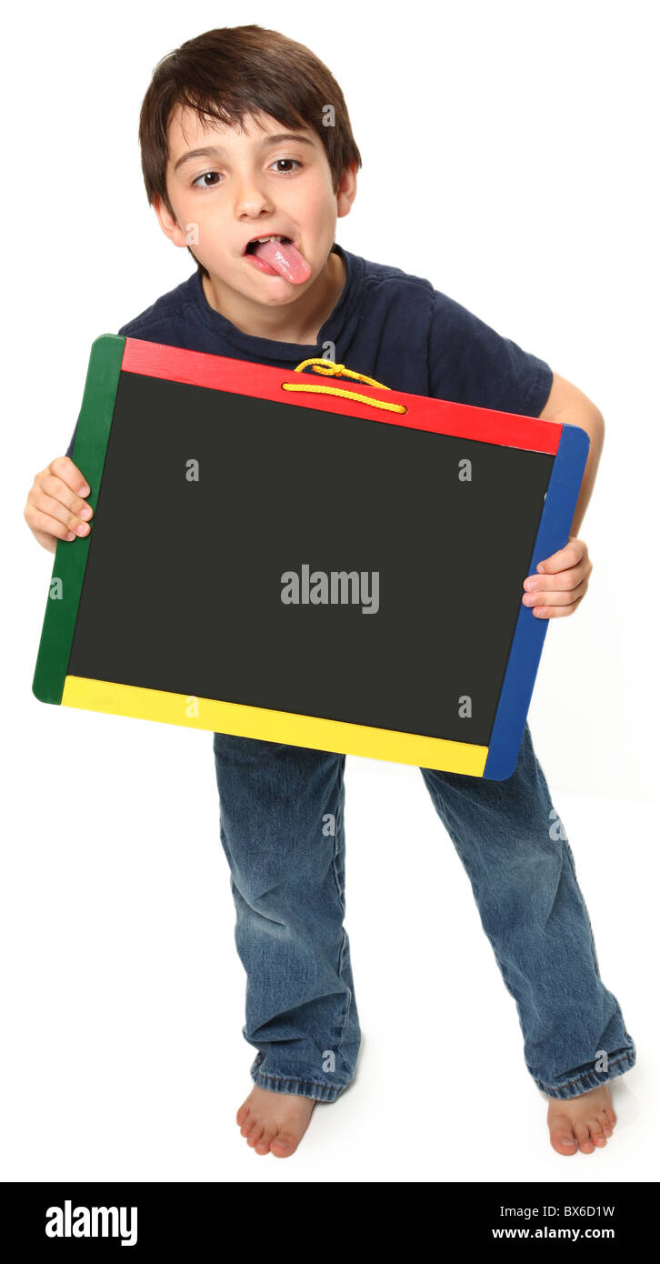adorable seven year old boy holding blank chalk board Stock Photo