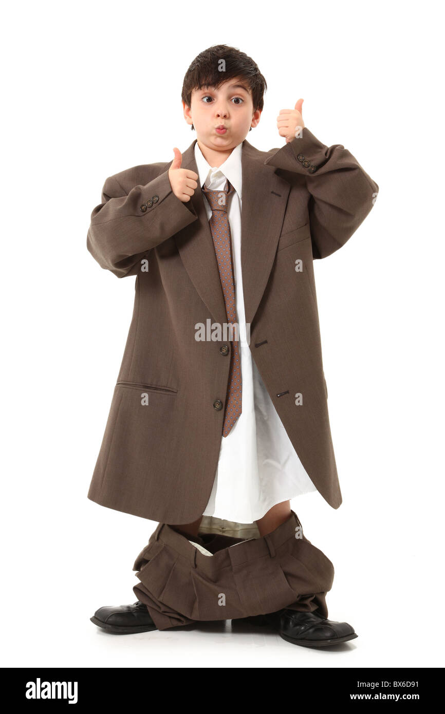 Adorable seven year old french american boy in over sized suit. Stock Photo