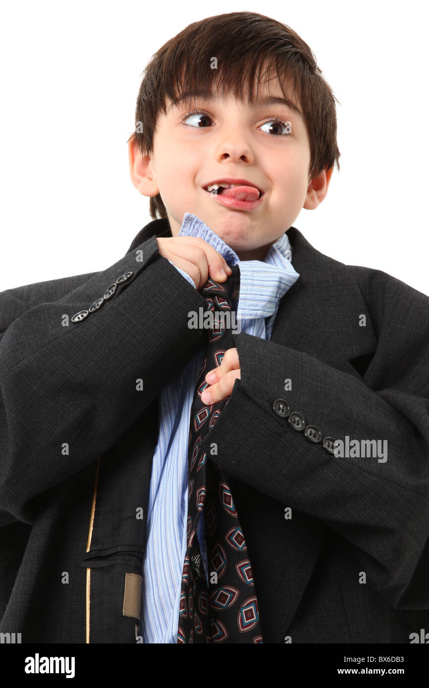 Adorable seven year old french american boy in over sized large suit