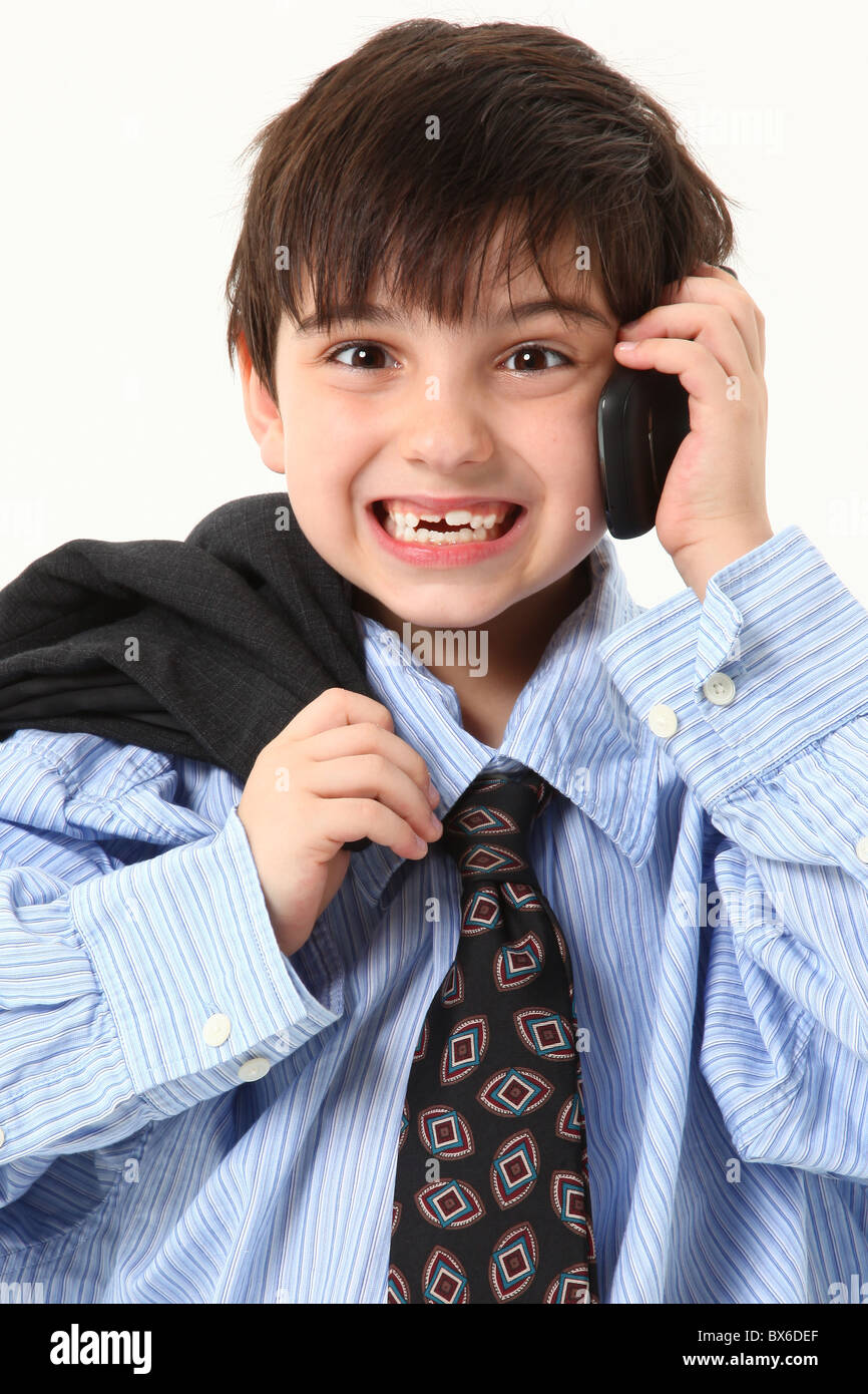 Adorable seven year old french american boy in over sized suit over