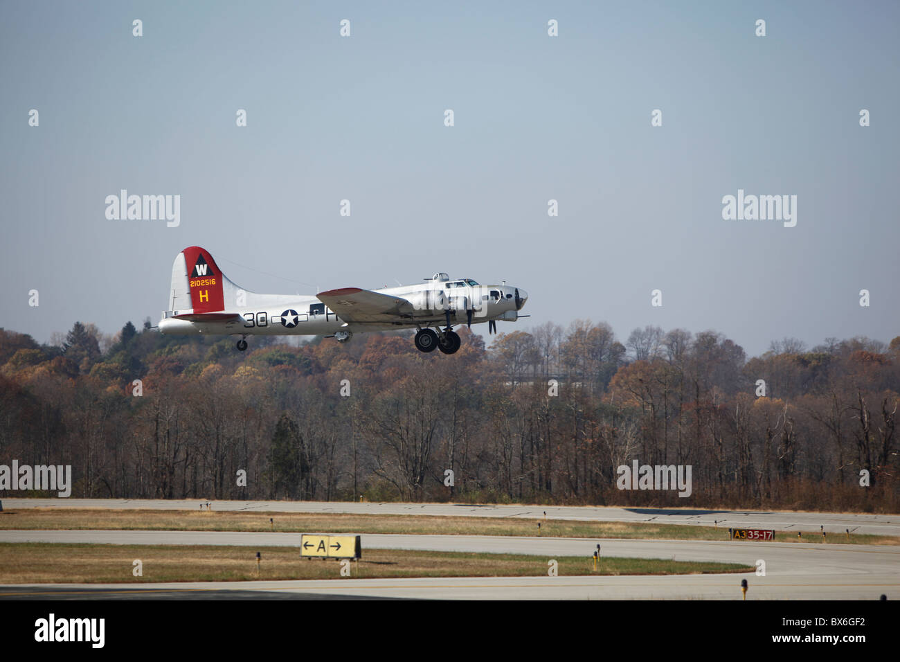Aluminum Overcast restored B-17 Flying Fortress WWII era bomber flight taking flight off air runway army air corps airport monroe county indiana bloomington Stock Photo