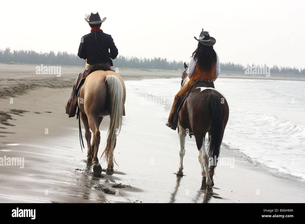 Two People Riding A Horse Together Goimages Inc