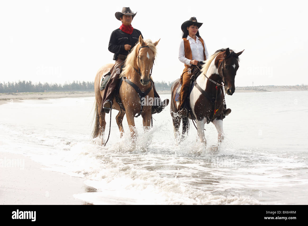 Two People Riding A Horse Together Goimages Inc