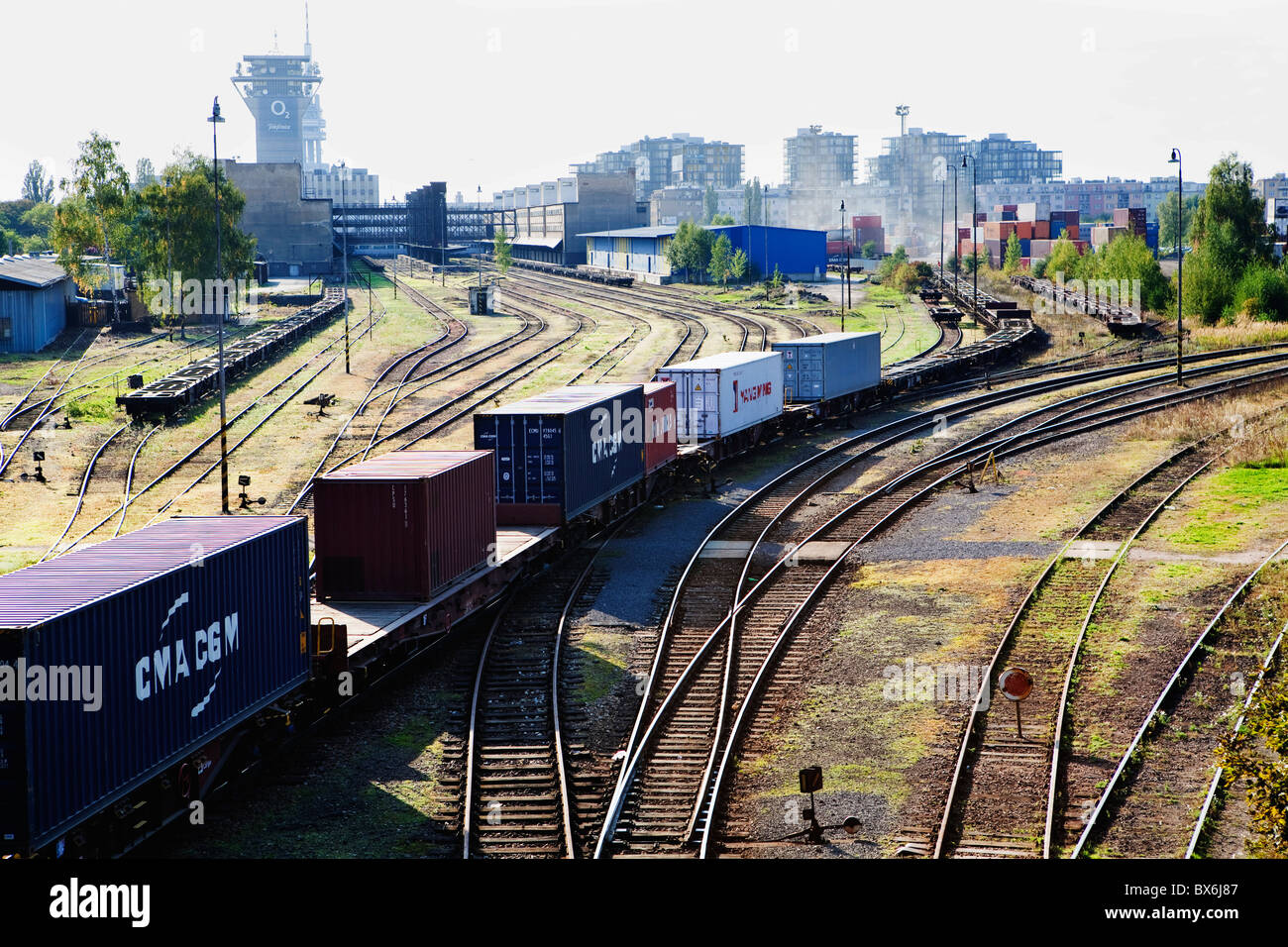 Freighttrain carries shipping containers from goodsstation Praha