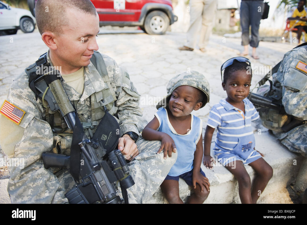 US Army soldier at an orphanage in Port au Prince after the 2010 earthquake, Port au Prince, Haiti, West Indies Stock Photo