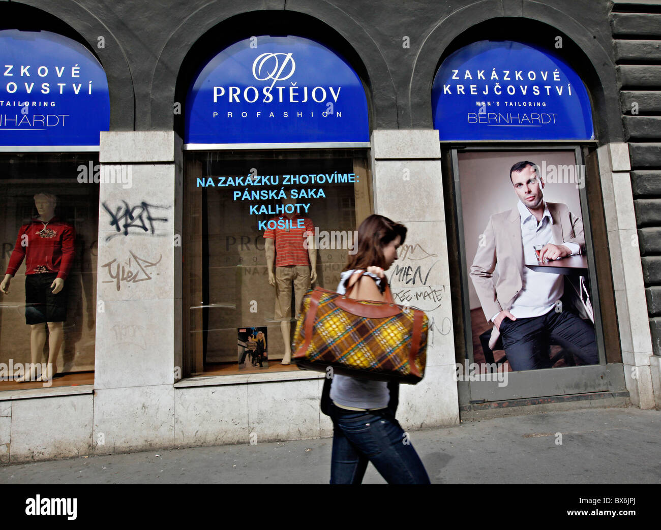 Prague - Czech Republic. Woman passes Prostejov fashion store. OP Prostejov  is an important producerd of ladies an men fashion Stock Photo - Alamy