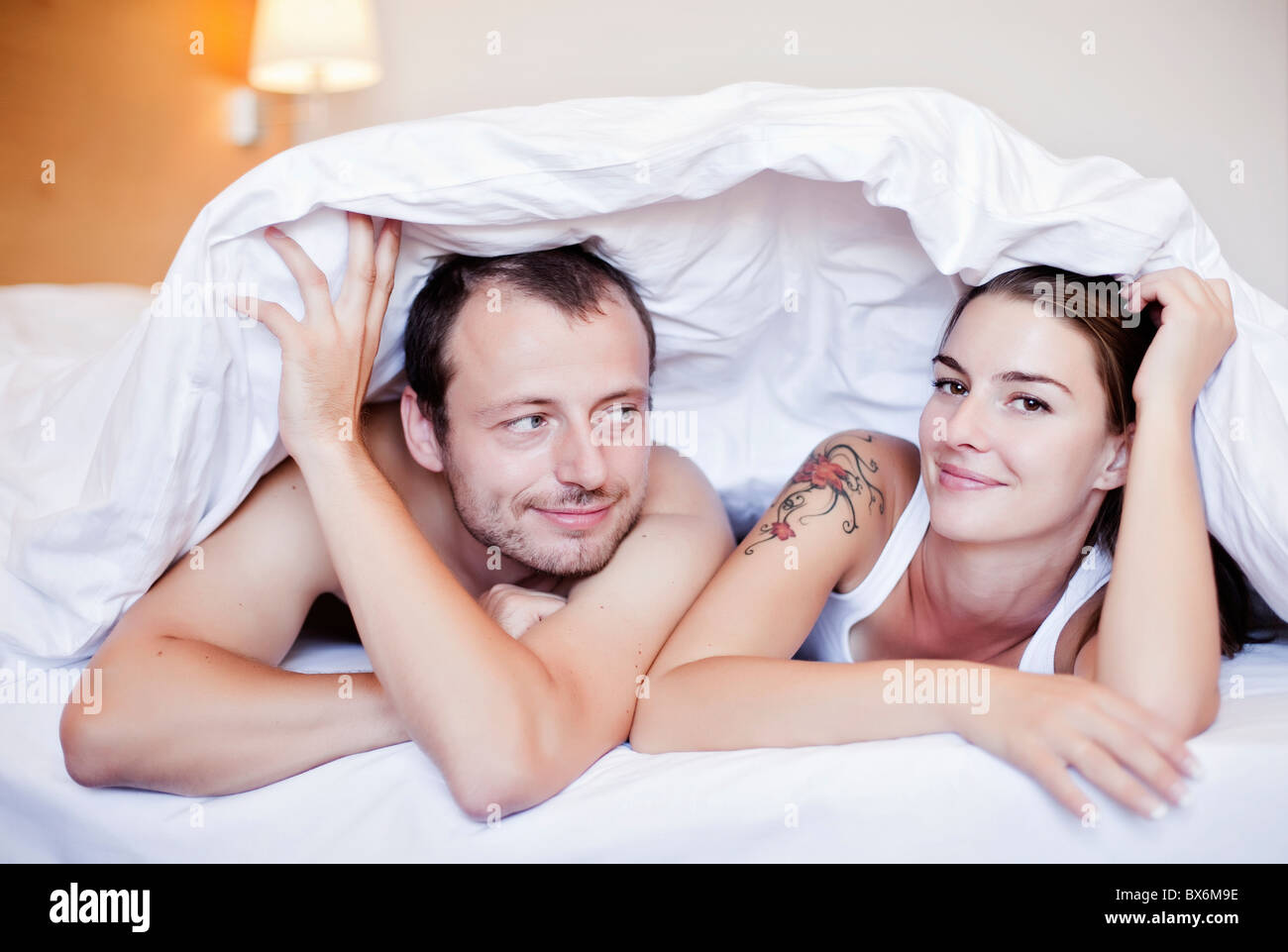 Man, woman, bed Stock Photo - Alamy