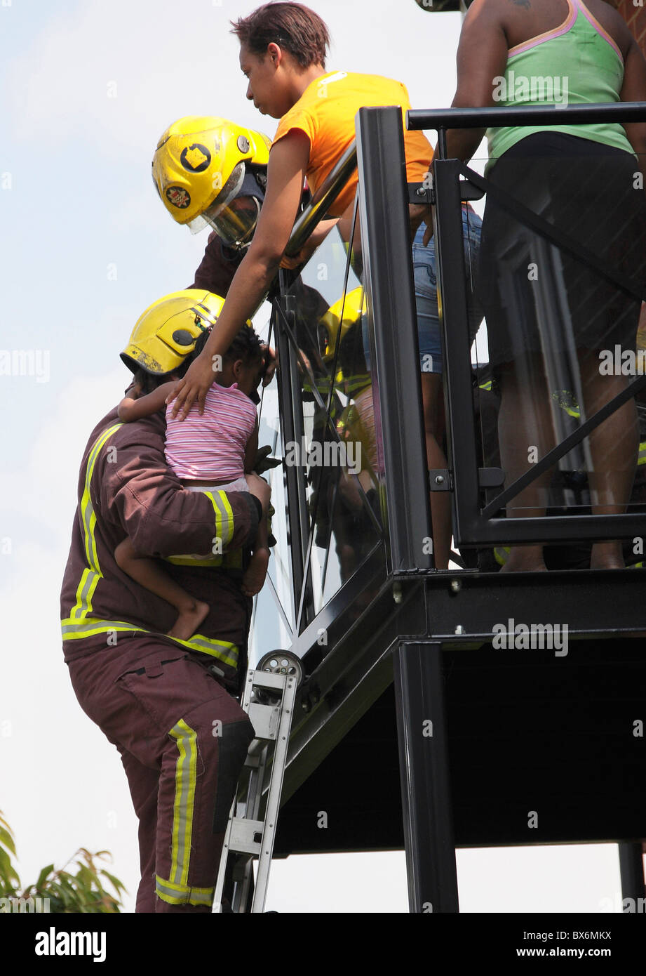Fireman rescue a family trapped on a balcony Stock Photo - Alamy