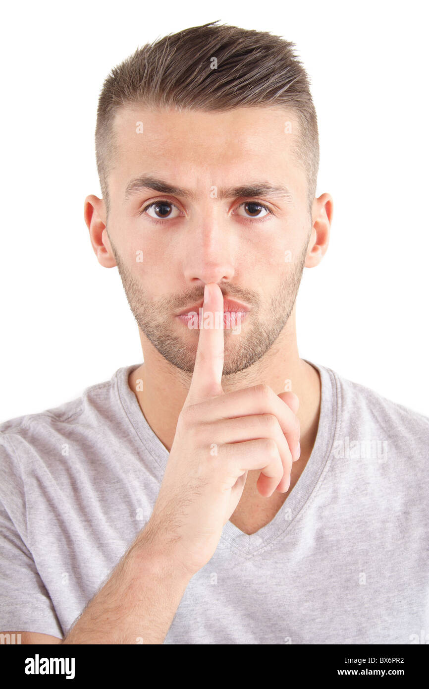 A handsome man asks for silence. All isolated on white background. Stock Photo