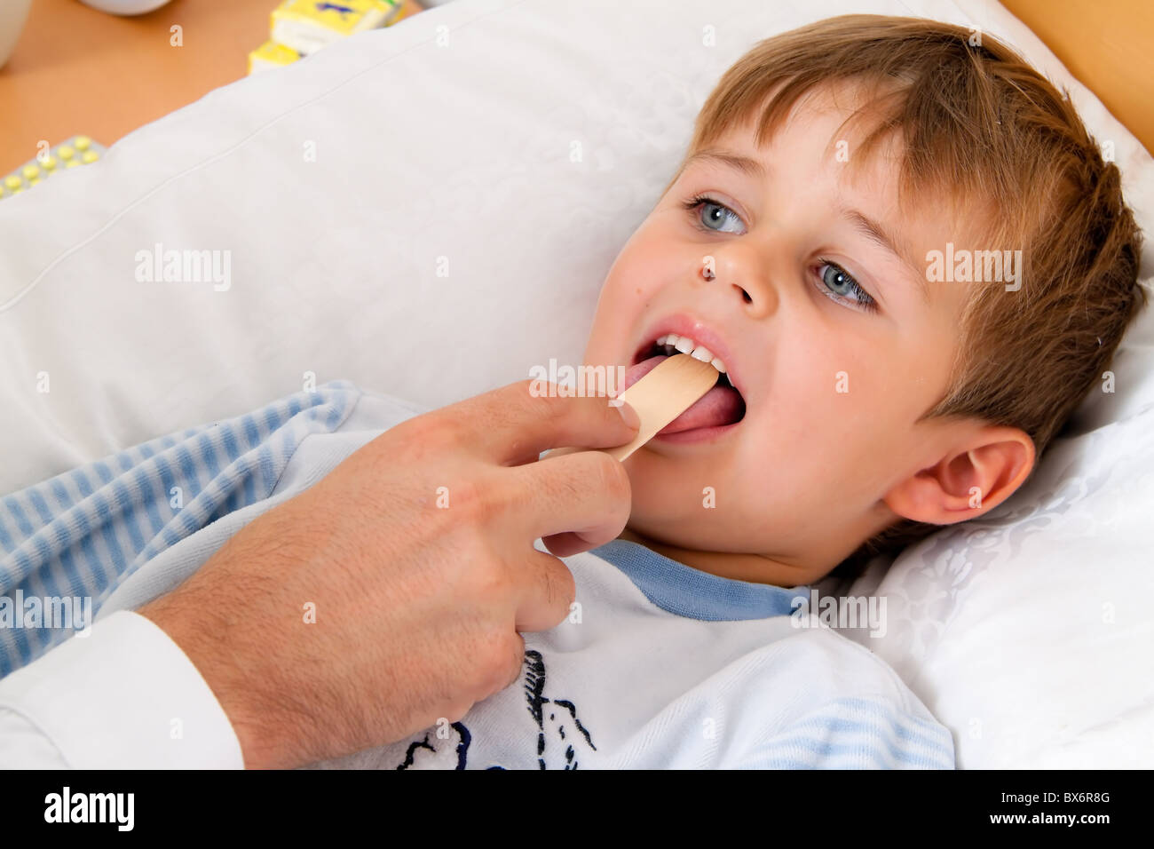 sick child in bed Stock Photo
