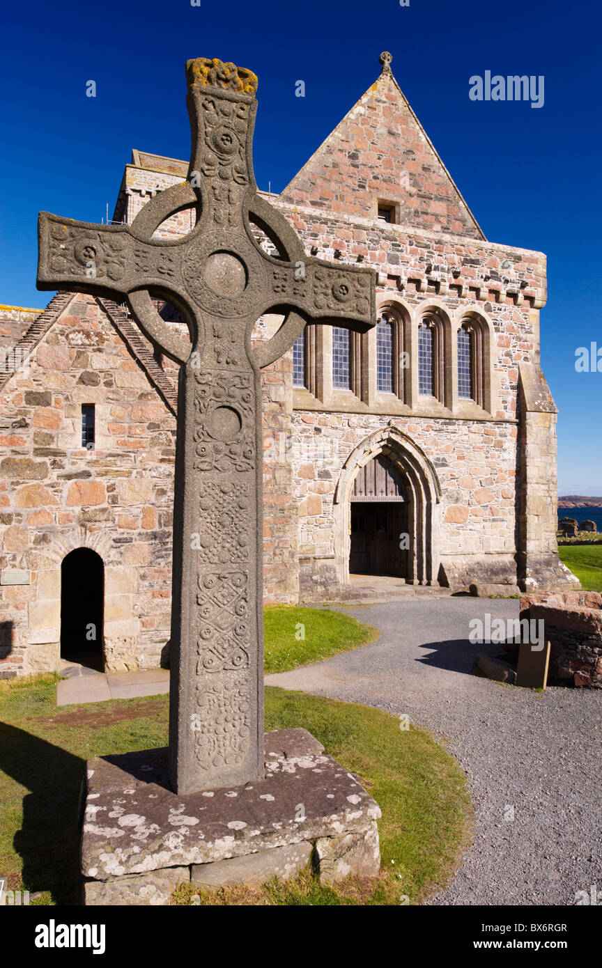 Replica of St. John's cross stands proudly in front of Iona Abbey, Isle of Iona, Scotland, United Kingdom, Europe Stock Photo