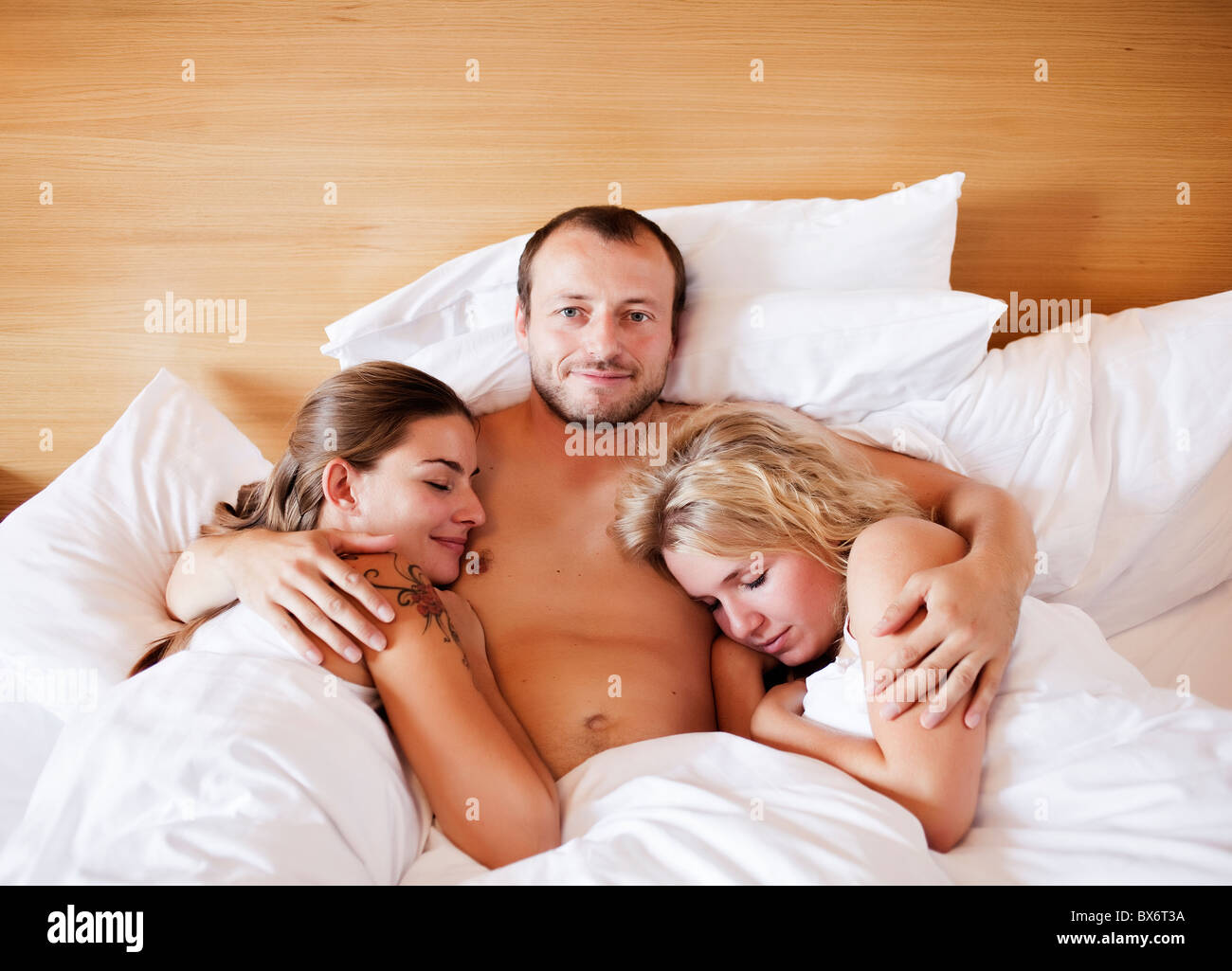 marriage, marital triangle, man, woman, women, bed, sex Stock Photo image