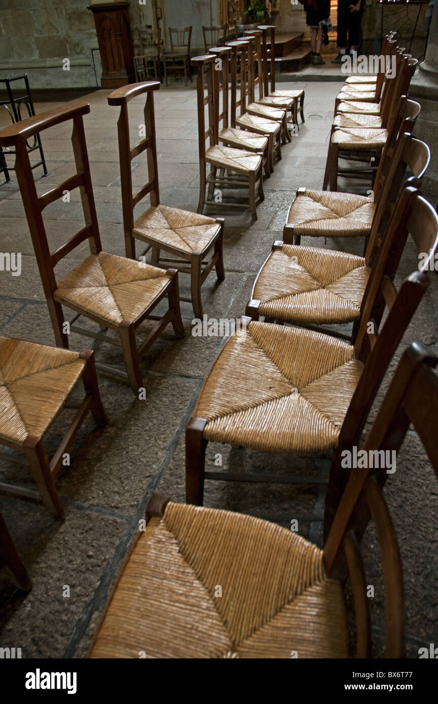 Empty chairs inside the Basilica of the Saint Sauveur, Dinan, France. Stock Photo