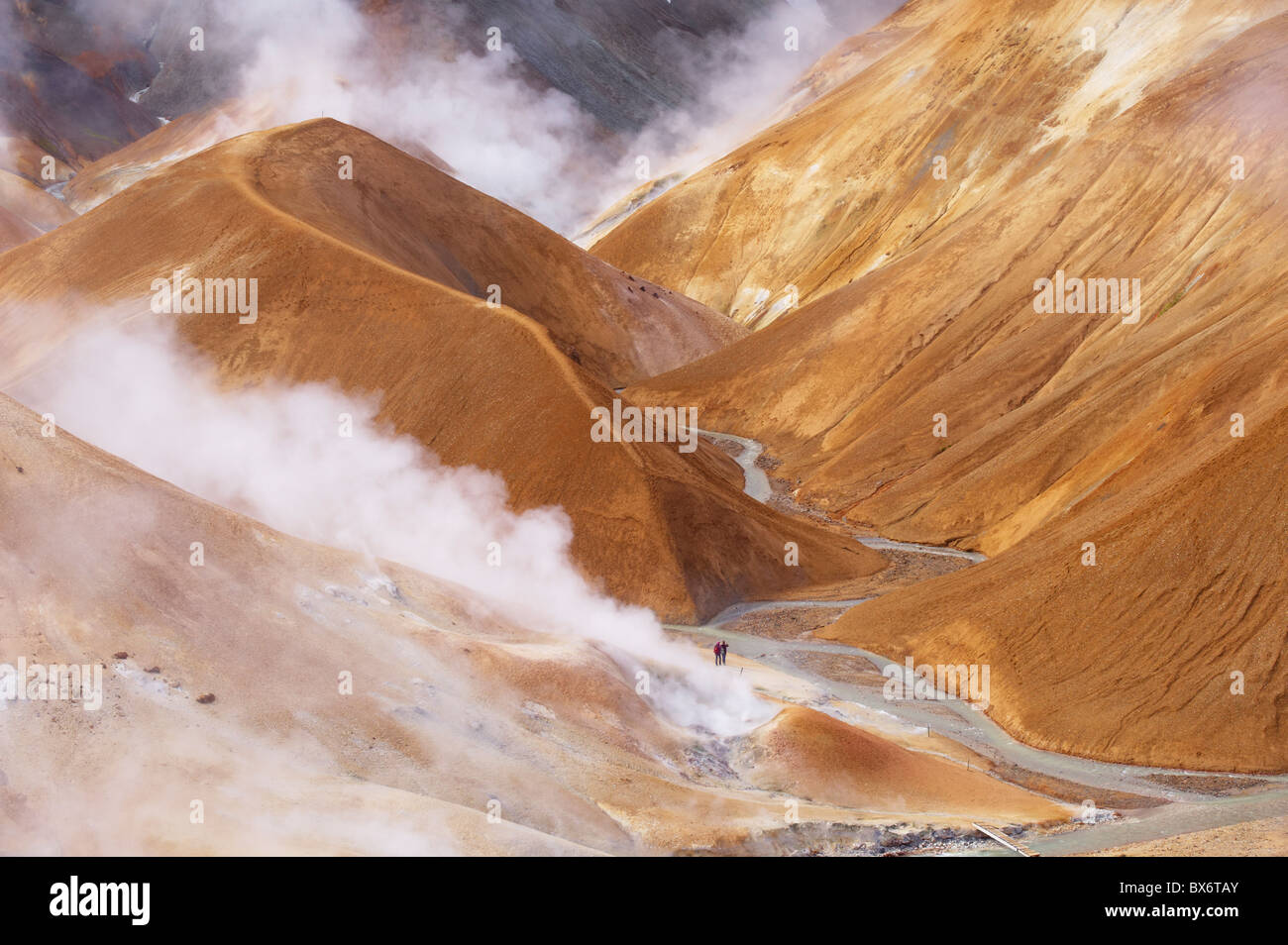 Hikers exploring the very active hot spring area at Kerlingarfjoll, Iceland Stock Photo