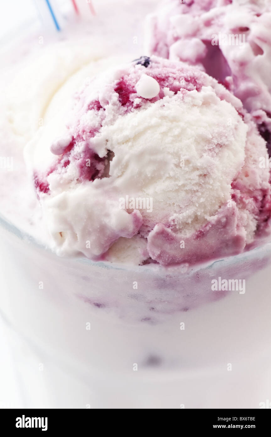 Milkshake with vanilla and cherry ice as closeup in a glass Stock Photo