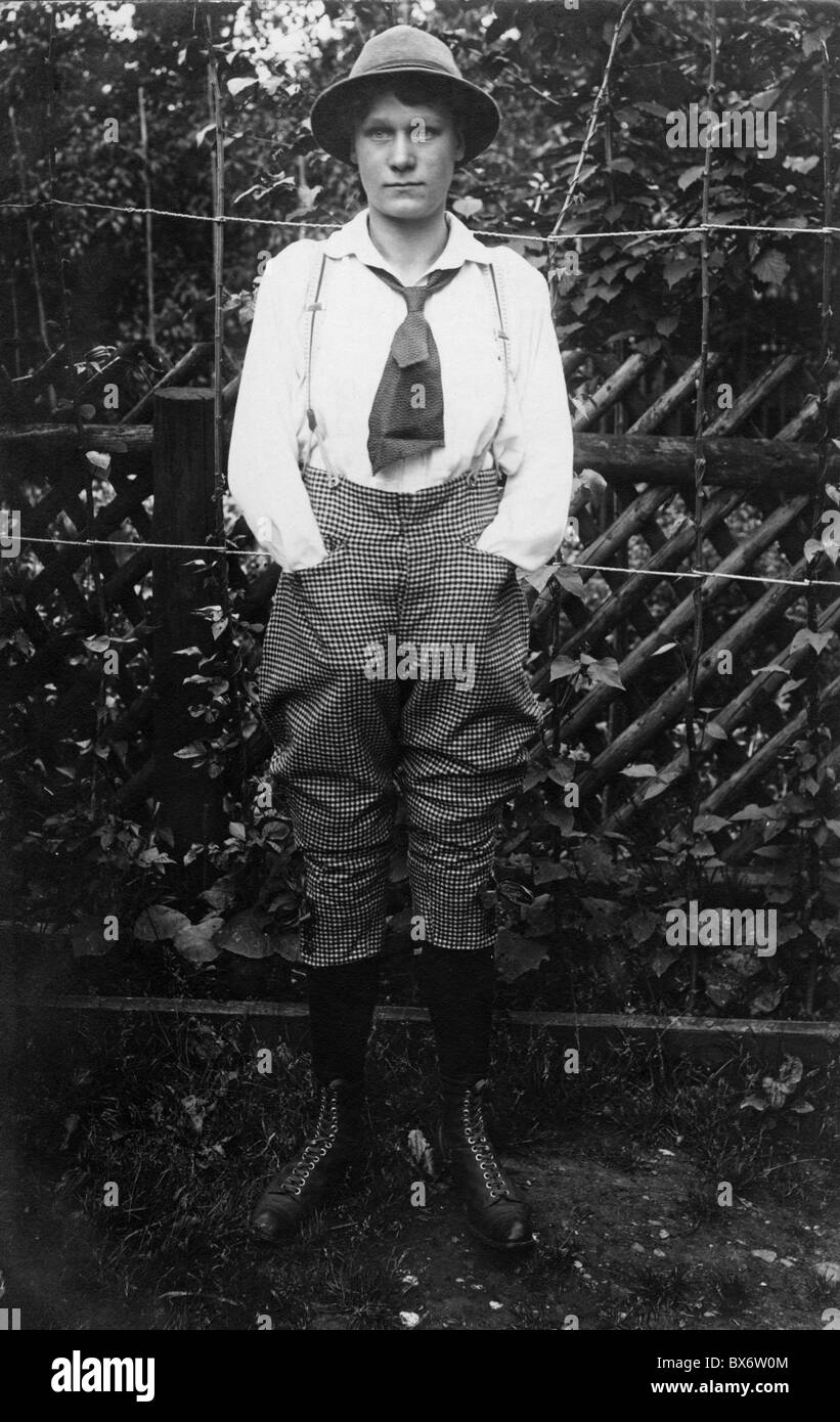 people, women, 1900 - 1930, young woman in men's clothing, circa 1900, trousers, checked, chequered, checkered, shirt, braces, full length, historic, historical, woman, women, female, people, 20th century, 1900s, Additional-Rights-Clearences-Not Available Stock Photo