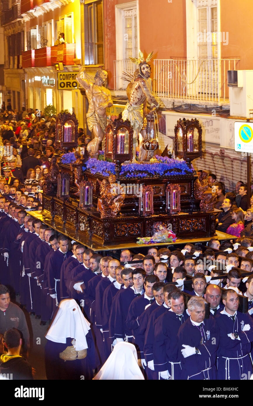 Religious float being carried through the streets during Semana Santa (Holy Week) celebrations, Malaga, Andalucia, Spain, Europe Stock Photo