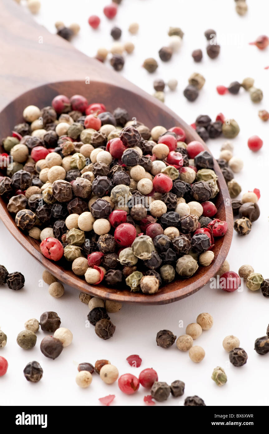 Pepper corn mix as closeup on teak spoon Stock Photo