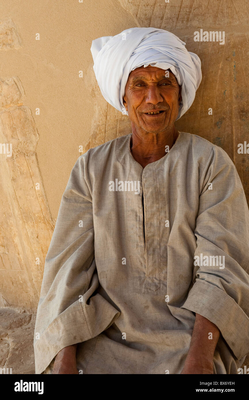A striking portrait of an old Egyptian man in traditional dress looking