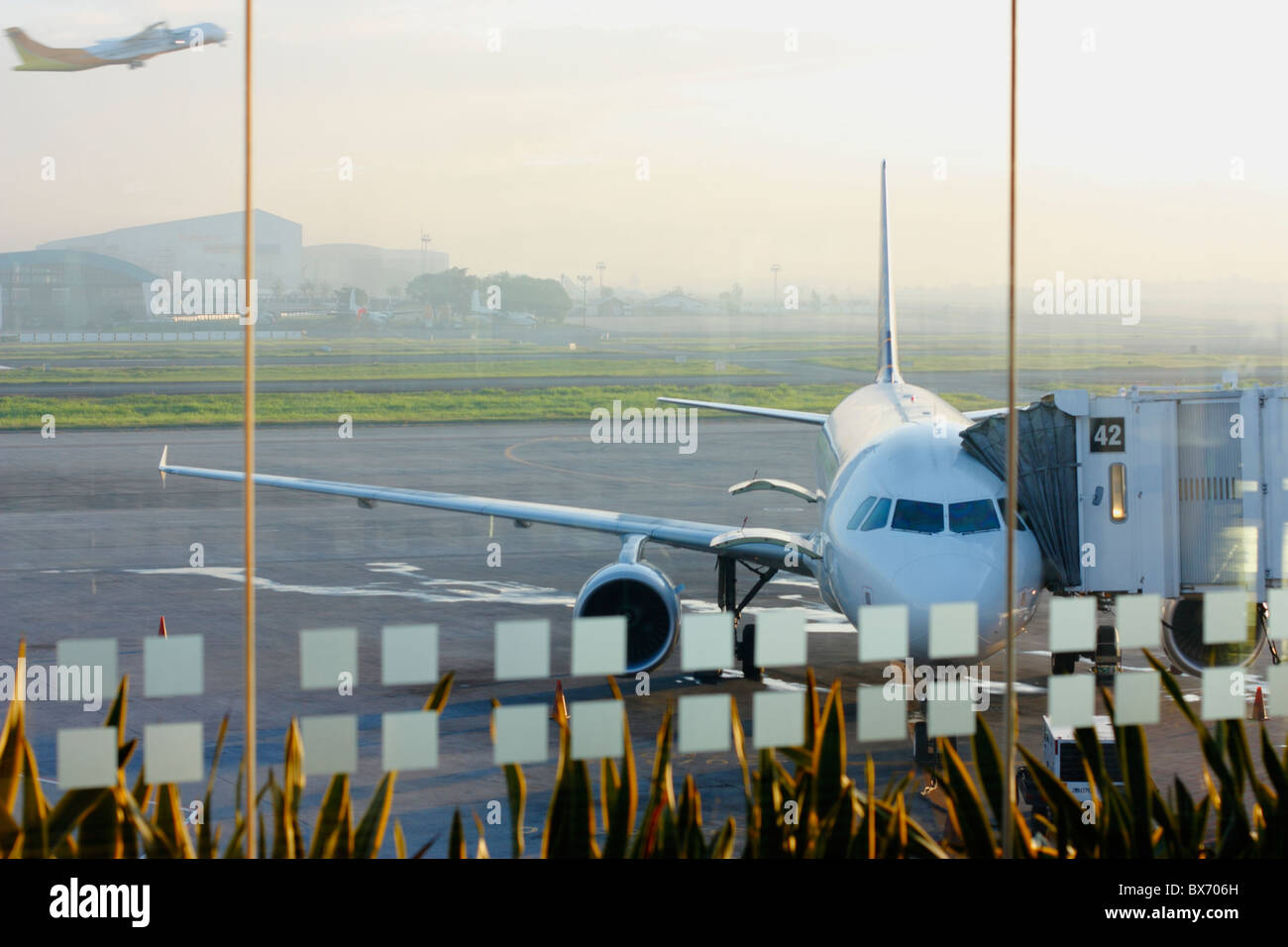 A passenger jet during early morning. Ninoy Aquino International Airport in Manila, Philippines. Asia Stock Photo