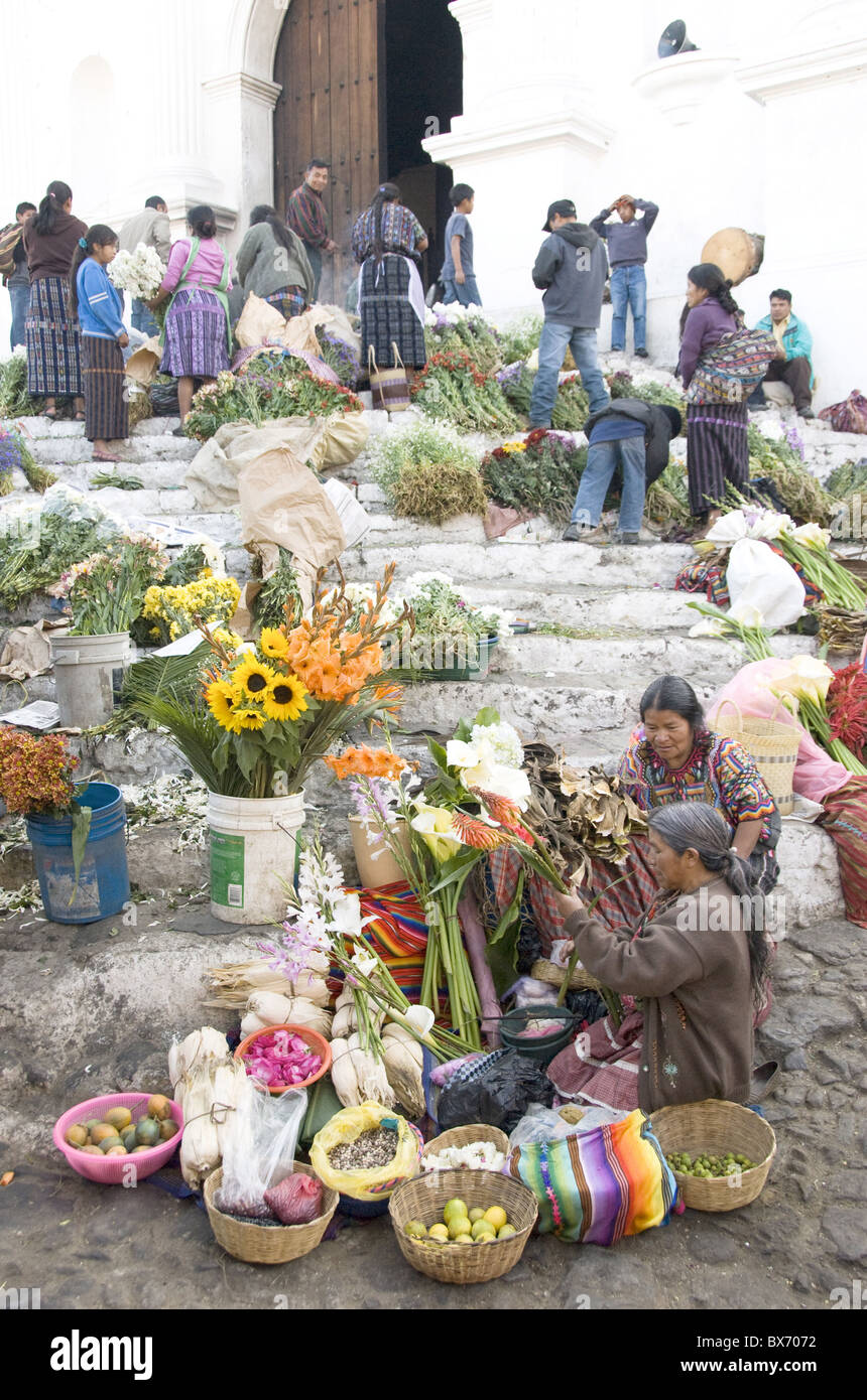 Indigenous Mayans selling flowers on the steps of the Santo Tomas church, Chichicastenango, Guatemala, Central America Stock Photo