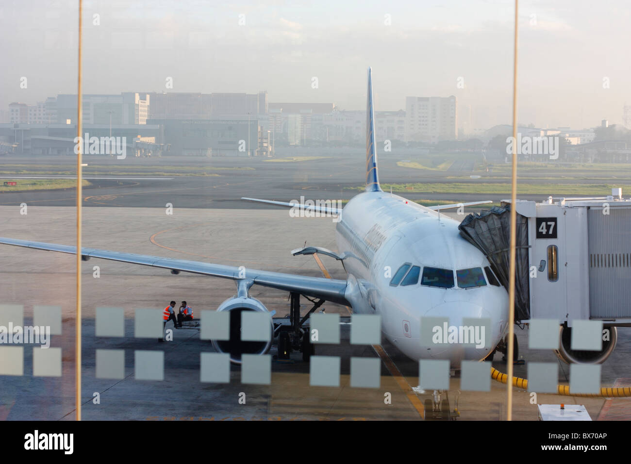 A passenger jet during early morning. Ninoy Aquino International Airport in Manila, Philippines. Asia Stock Photo
