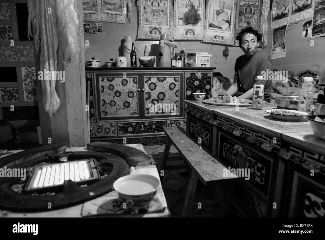 tibetan man inside his house,derge,sichuan,china Stock Photo