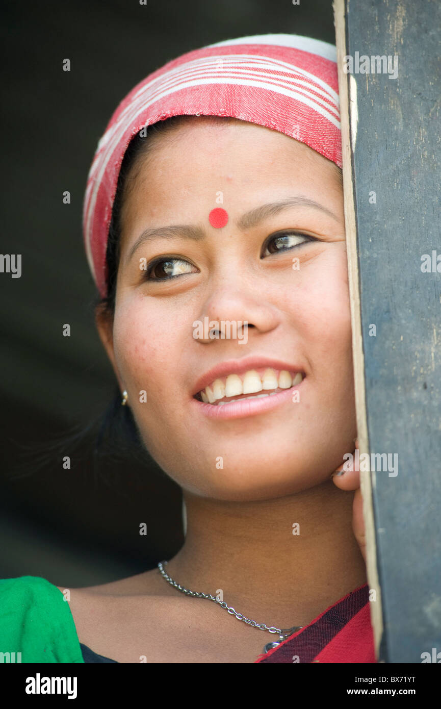 Smiling married woman from the Mishing tribe wearing typical Assamese domestically woven scarf
