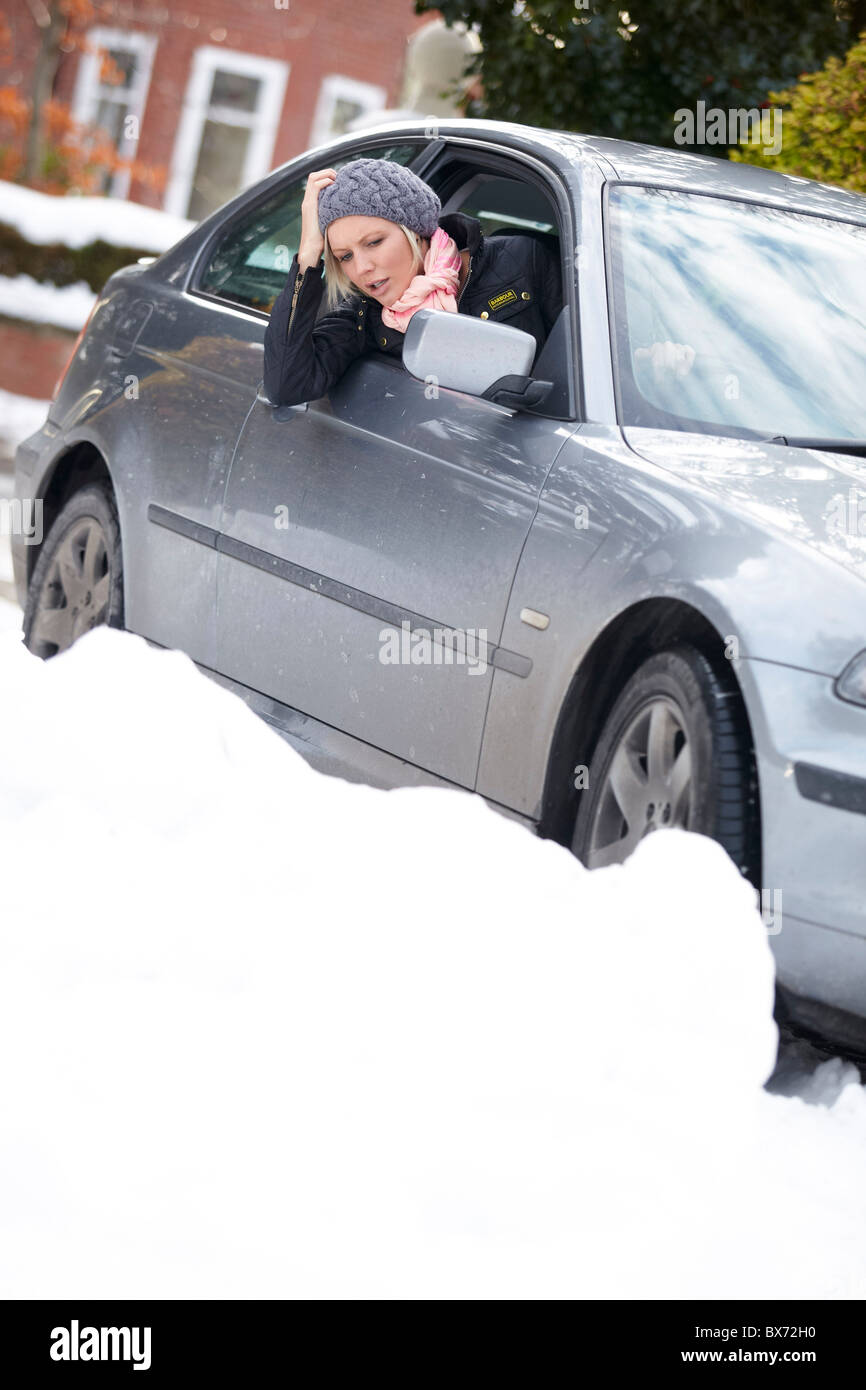 Woman stuck in snow Stock Photo