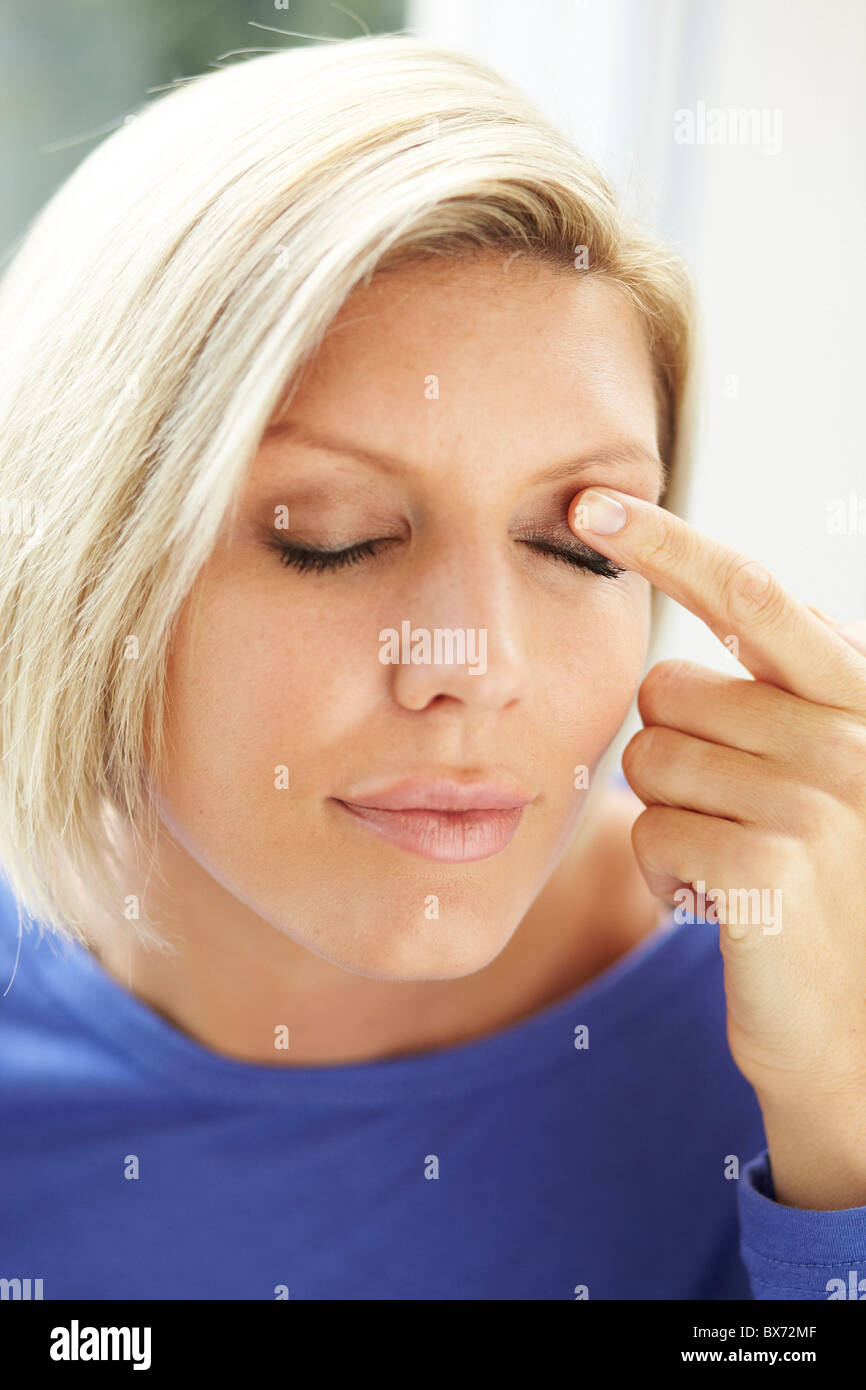 Woman rubbing eyes Stock Photo Alamy