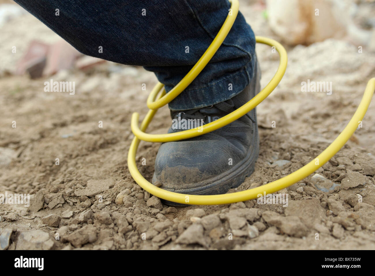 Site hazard tripping over an electric cable Stock Photo Alamy
