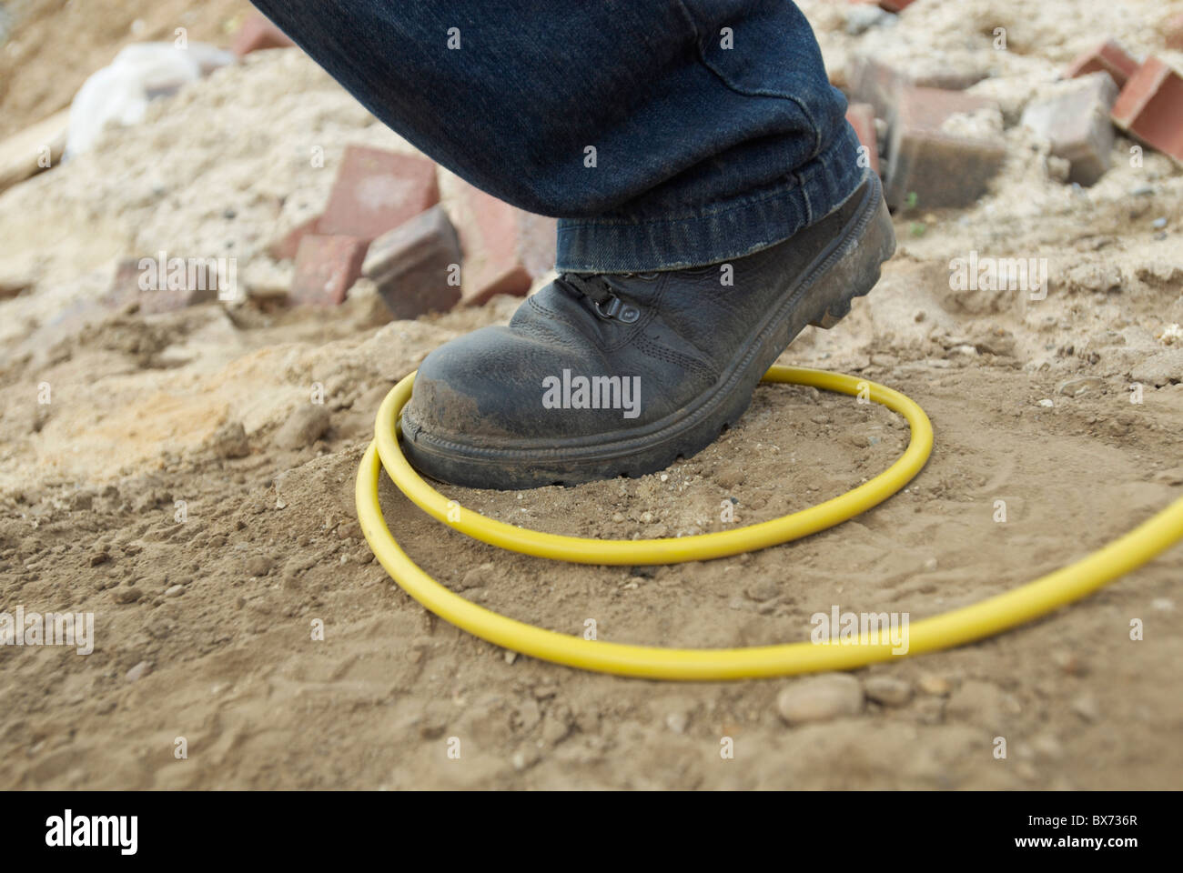 Site hazard tripping over an electric cable Stock Photo Alamy