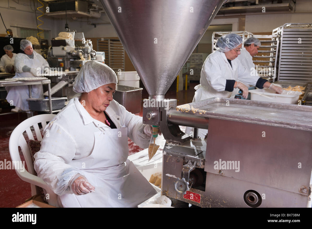 People working at food processing plant, making tamales, Miami, Florida