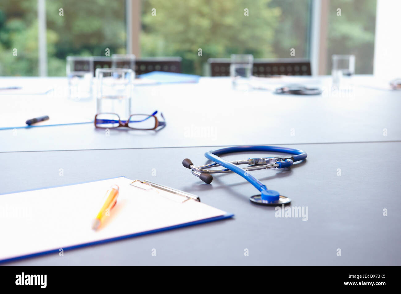 Stethoscope and furniture on table Stock Photo