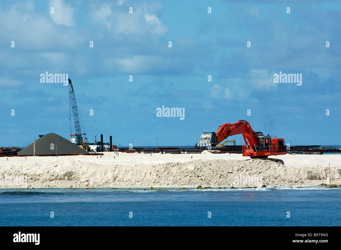 Maldives ari atoll crane at work on the construction of a new airport on an island Stock Photo