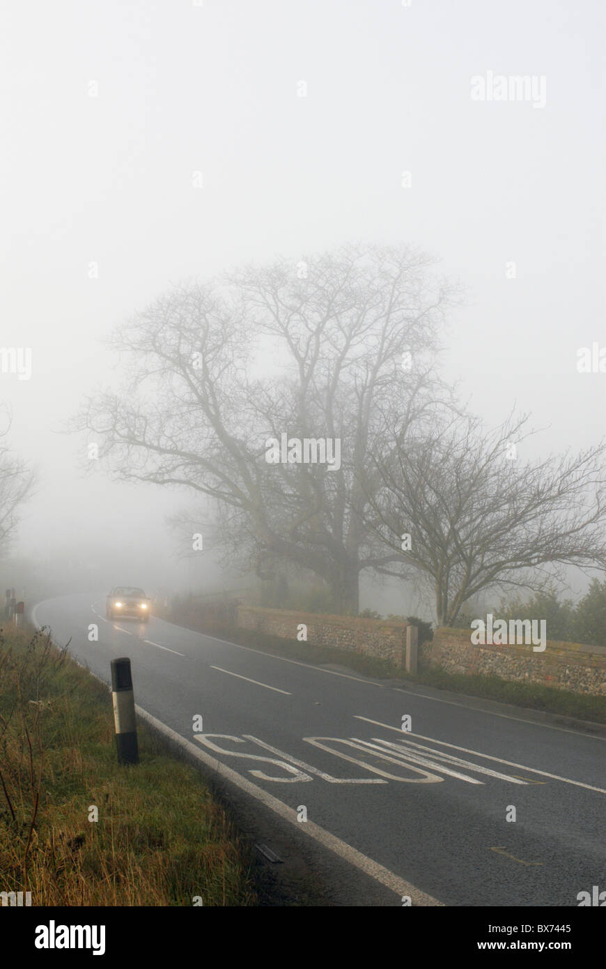 Car driving in fog UK Stock Photo Alamy