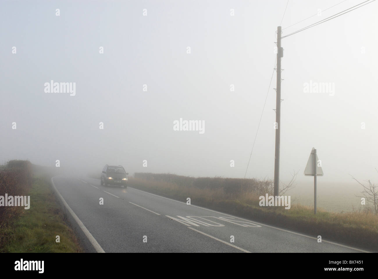 Car driving in fog UK Stock Photo Alamy
