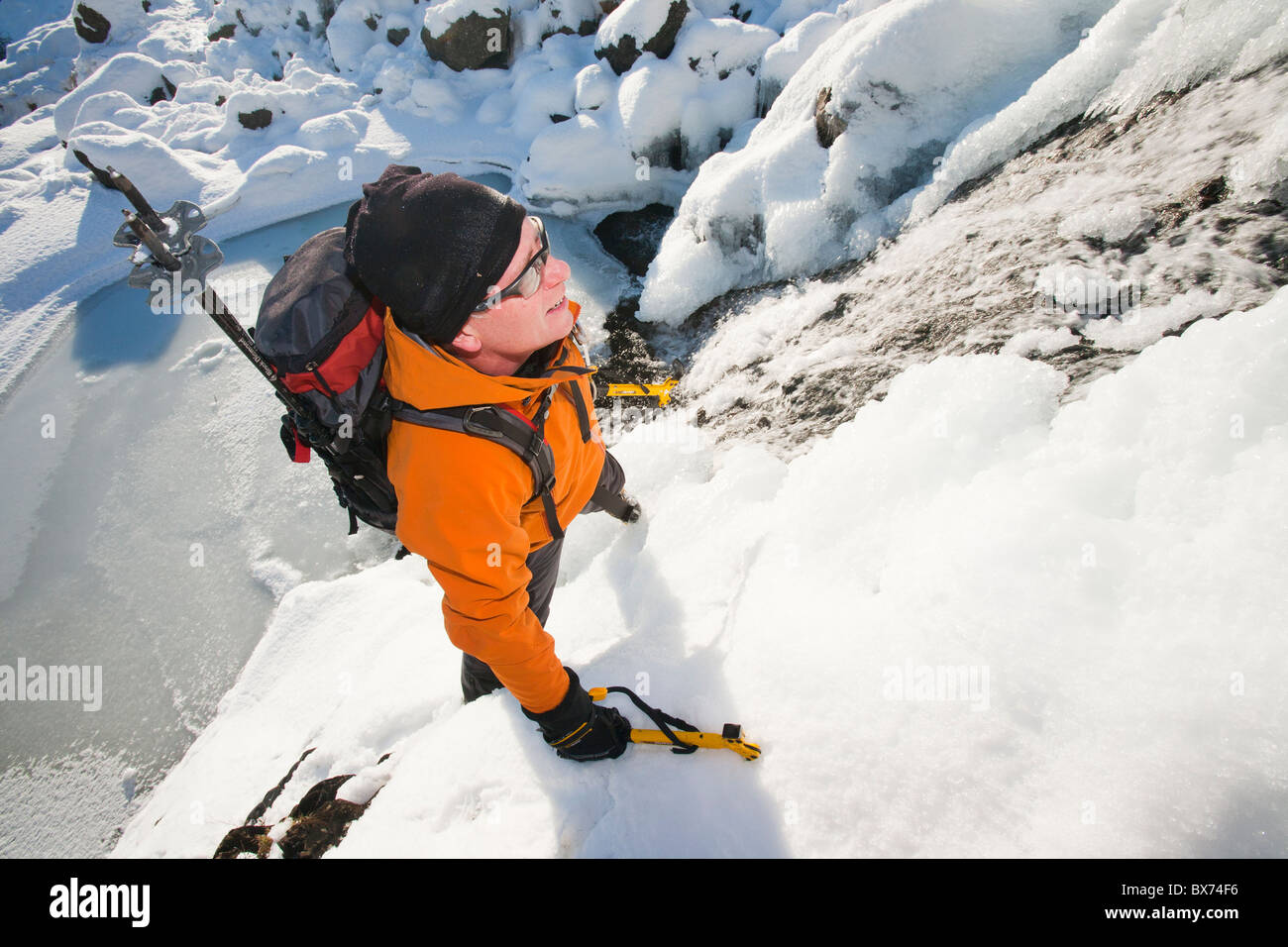 Man climbing ice fall hi-res stock photography and images - Alamy
